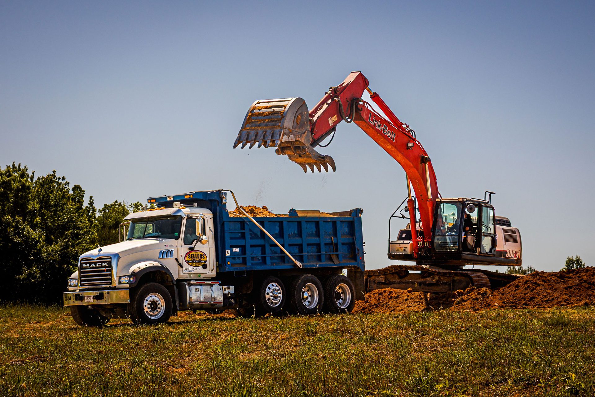 Sellers Brothers Mack dump truck being loaded by a Link-Belt excavator
